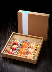 A delicious combination of Japanese sushi dishes ,in a paper takeaway package