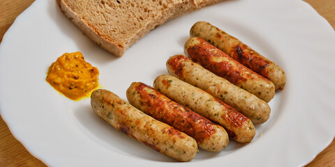 Nuremberg sausages on plate