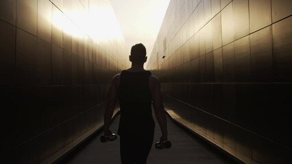Young Muscular Man Doing Sports Outside at Sunset. Training of a Young Strong Athlete. Fitness and Healthy Lifestyle Concept.