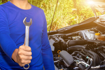 Auto mechanic or driver checks steering and gear system and start system before driving at service...