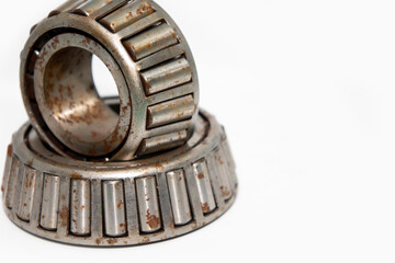old roller bearing with traces rust, isolated on white background.