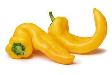 Pair of yellow deformed homegrown yellow pointed bell peppers isolated on white background