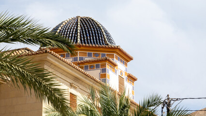 Exterior of a lovely dome atop a building in the Old Town of Alicante in Spain. - obrazy, fototapety, plakaty