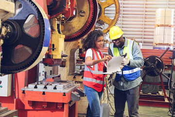 The workers working in factory with colleague or team, technician discussing together about repair and maintenance the machine in industry