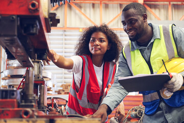 The workers working in factory with colleague or team, technician discussing together about repair and maintenance the machine in industry