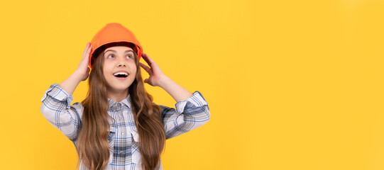 happy teen girl in helmet and checkered shirt, architect. Child in hard hat horizontal poster design. Banner header, copy space.
