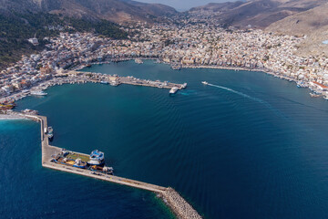 Aerial view of Kalimnos town and its port on sunny day. Kalymnos island, Aegean Sea, Greece.