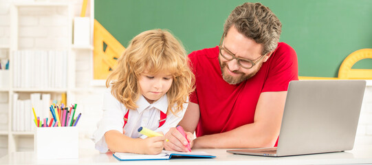 Banner of teacher and pupil school boy with laptop at lesson, teacher man and kid study in classroom with laptop, fatherhood