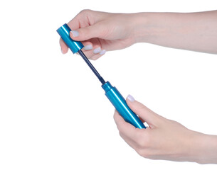 Hand holding mascara in blue tube on white background isolation
