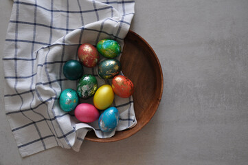 beautiful colorful decorated easter eggs in a bowl