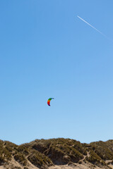 Fototapeta na wymiar colorful kite in the air over beach