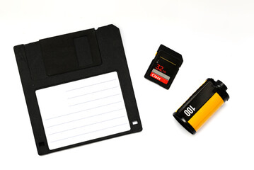 photographic film and floppy disk and memory card on white background