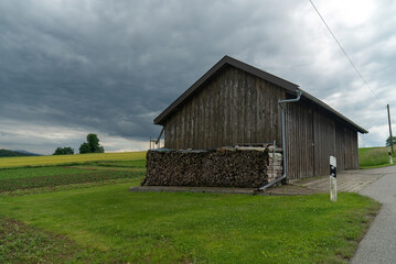Plakat Mountains And Old Wooden Barn In The Field