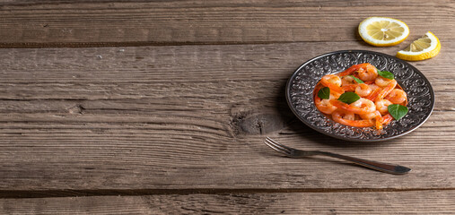 Roasted shrimps with basil leaves. With copy space.
