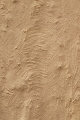Abstract relief wrinkled texture on beige background