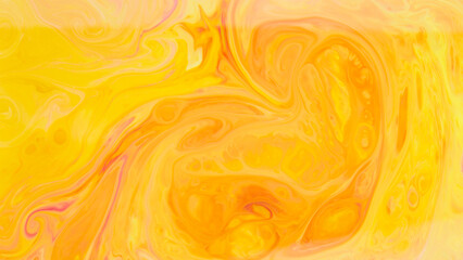 Abstract trendy golden orange backdrop. Yellow and orange paint pigment mix background. Fluid art