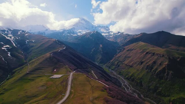 ascending view of a winding road in the Caucasus Mountains, Kazbegi, Georgia. High quality 4k footage