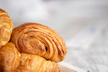Croissant macro. French croissant with waves. Air baking. Croissant for puff pastry advertising. Croissant for a magazine.French breakfast with pastries. From puff pastry. Bun from France. Roll macro