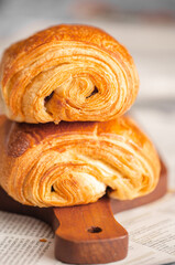 Croissant macro. French croissant with waves. Air baking. Croissant for puff pastry advertising. Croissant for a magazine.French breakfast with pastries. From puff pastry. Bun from France. Roll macro