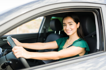 Fototapeta na wymiar Gorgeous woman driving without traffic