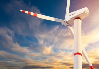 Fototapeta premium Wind station. Eco windmill on background sky. Fragment of wind turbine. Wind turbine blades. Windmill blades in front of clouds. Environmentally friendly source of energy concept. Modern power plant