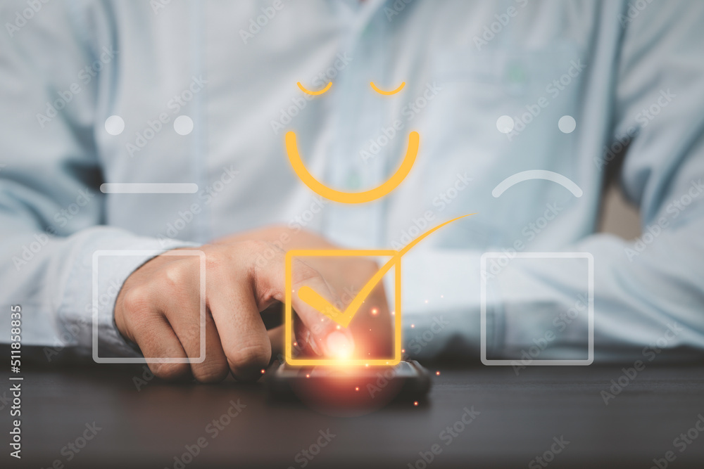 Poster Businessman using smartphone for select smiley face icon for client evaluation and customer satisfaction after use product and service concept.