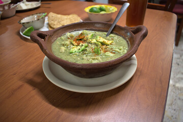 Typical mexican food served in a clay pot