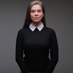 Strict teacher woman in black  suit with white collar, isolated female portrait.