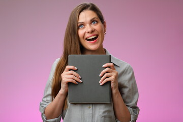Happy teacher or student woman holding book and looking up, isolated portrait.