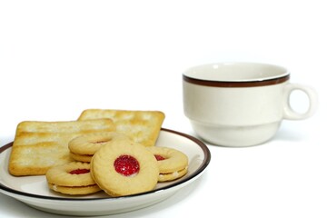 Photo of breakfast cookies, bread and coffee mugs.