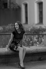 portrait of a beautiful girl sitting in the park. outdoors