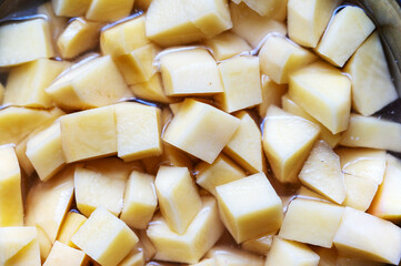Full frame diced potatoes. Raw vegetable without peel. Healthy Eating. Food, ingredients.