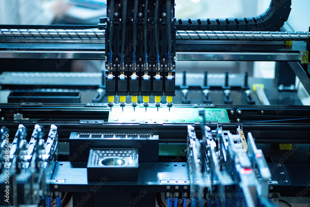 Poster pcb production. shot of factory machine at work: printed circuit board being. technology connecting 