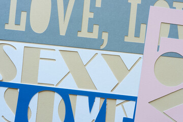 paper stencils with the words love and sexy
