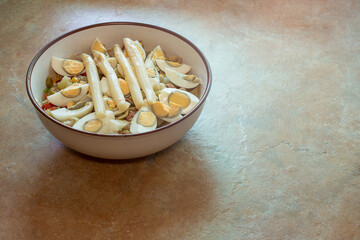 Country salad on a rustic countertop with natural light. Easy recipes and healthy food.