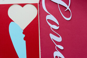 heart shape and the word love in script type (with blue paper object)