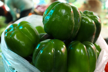 green colored capsicum stock on shop