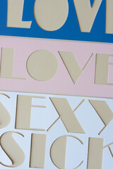 stencil background with the words: love, love, sexy, sick