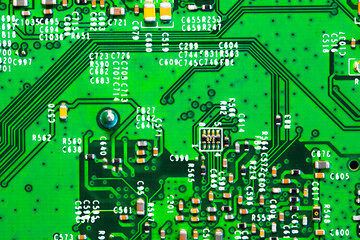 Close up of components and microchips on PC circuit board.