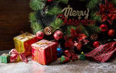 Christmas background.Christmas elements, fir tree, gifts, decorations on wooden background