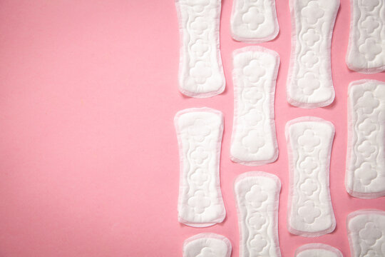 Menstrual pad on a pink background.
