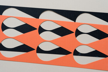 orange and black paper stencil w