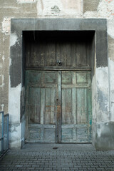 Green door in old concrete abandoned house. Poland, Warsaw.