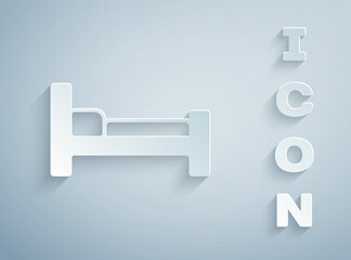 Paper cut Bed icon isolated on grey background. Paper art style. Vector