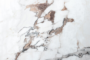 White marble stone texture top view. abstract pattern with grey and brown streaks for background or...