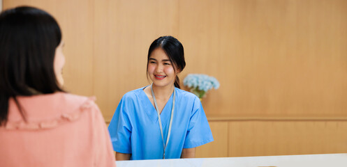 Receptionist and doctor with client. Hospital Healthcare medical and medicine concept.
