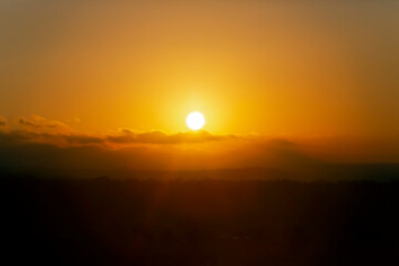 Sunrise in orange and yellow colour. Bright golden solar sunrise, summer template. Natural panoramic with bright sunlight background.