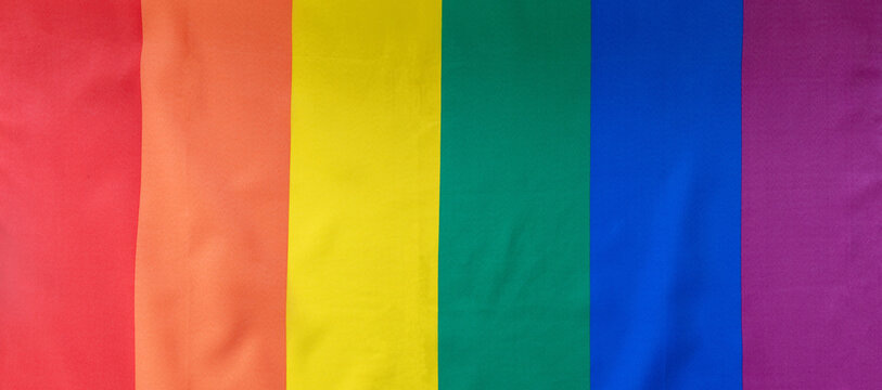LGBT Rainbow flag, Gay pride symbol background texture, overhead. LGBTQ community rights