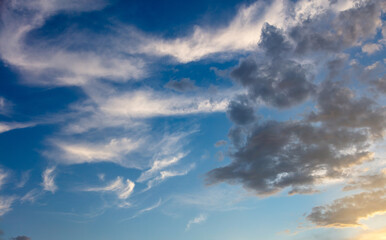 Fototapeta na wymiar Cloud on blue sky background. Cloudscape grey and orange shade. Twilight light color the cloudy sky