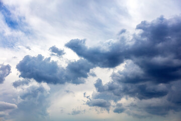 Fototapeta na wymiar Cloud on blue sky background. White and grey color cloudscape, gloomy weather